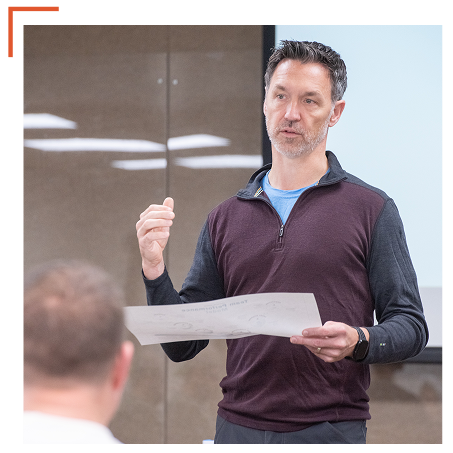 Retreat facilitator speaking to participants