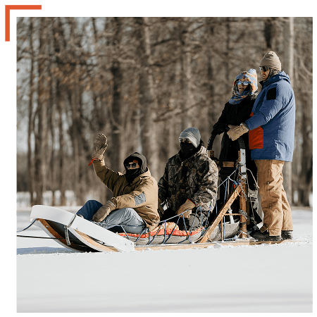 Retreat participants on sled dog sled