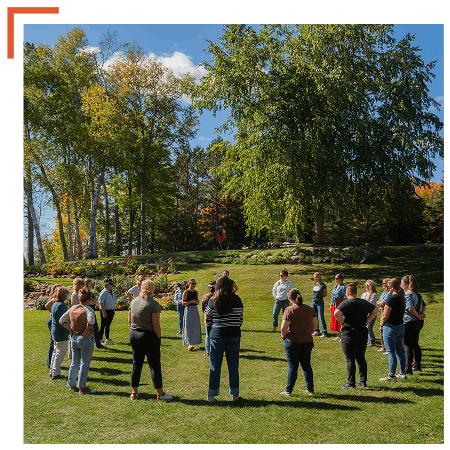 Leadership Lodge facilitator leading an outdoor activity
