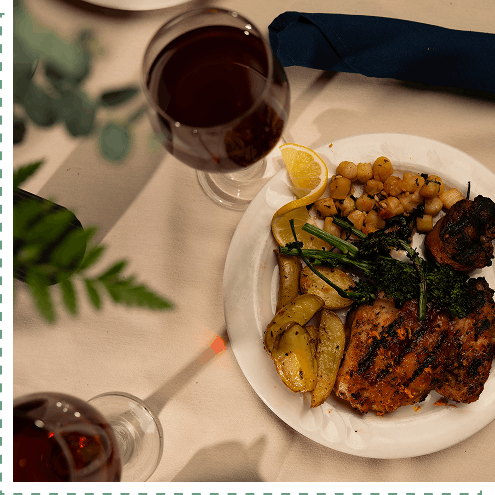 plated dinner and glass of wine