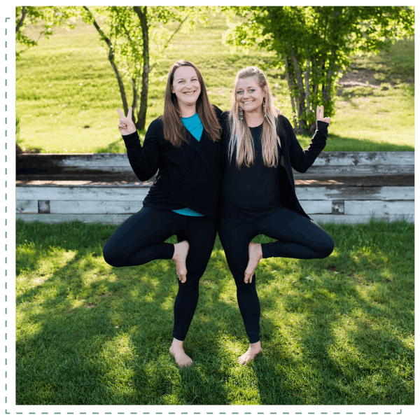Two women doing a yoga pose
