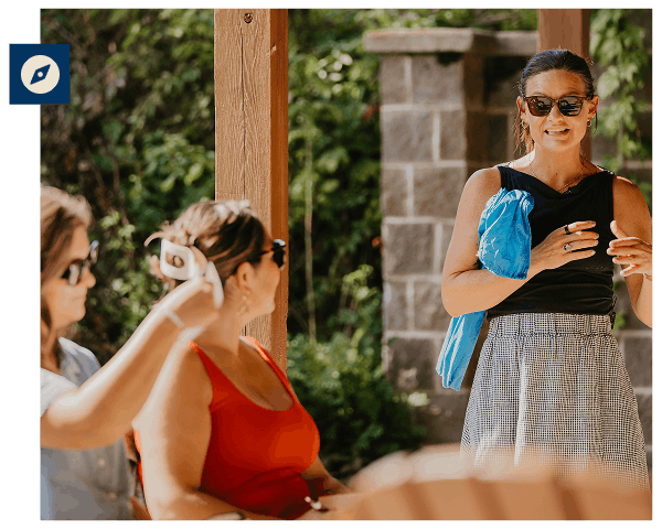 Retreat facilitator leading a group discussion outside