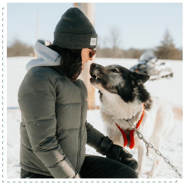 Prouty L3-2-min Retreat participant with sled dog