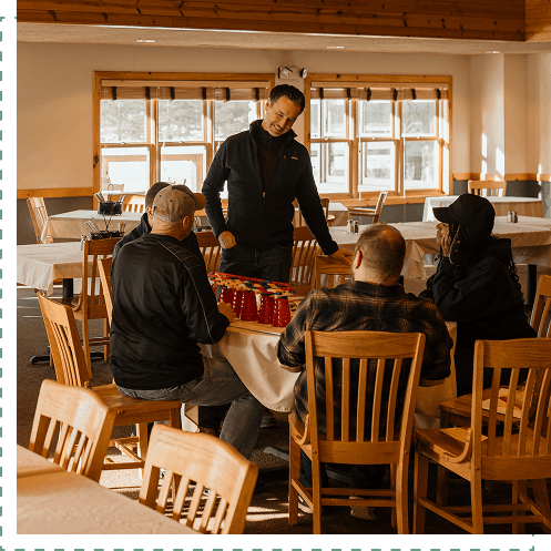 group participating in activity around a circle table